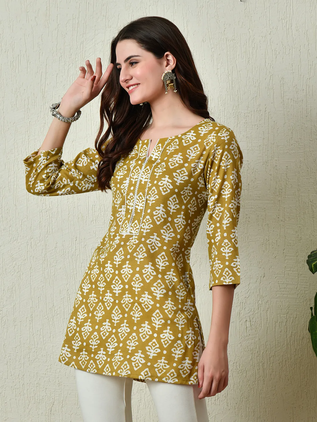 Women Stylish Mustard Cotton Short Kurti With Elegant Print