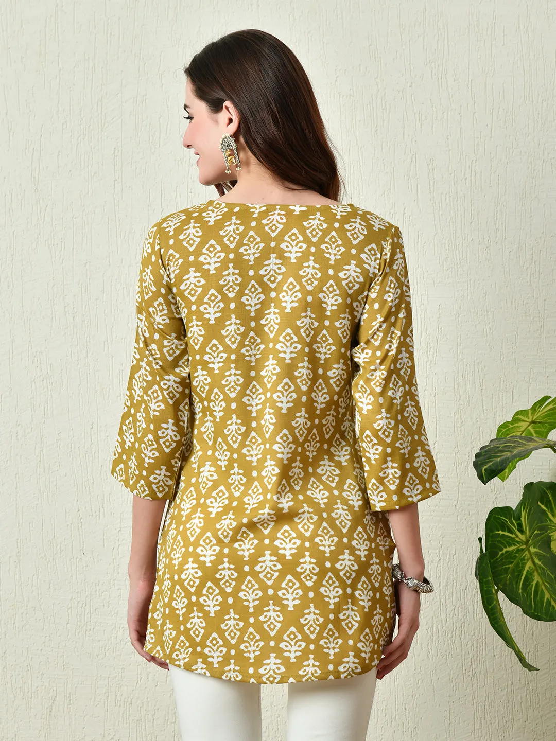 Women Stylish Mustard Cotton Short Kurti With Elegant Print