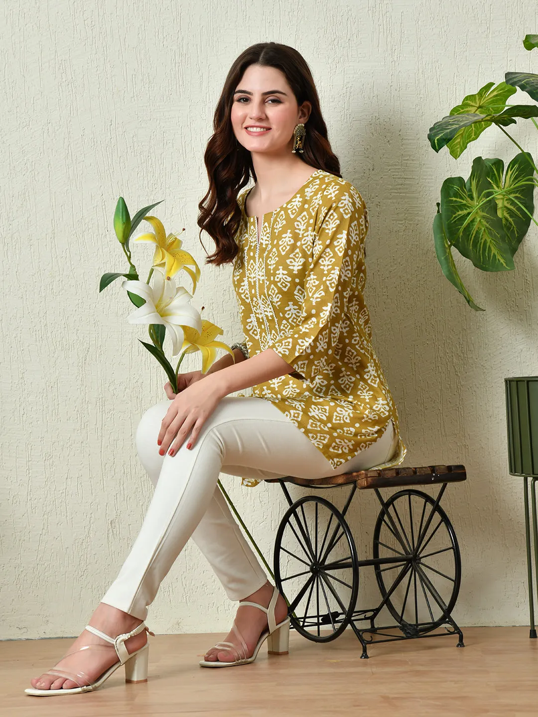 Women Stylish Mustard Cotton Short Kurti With Elegant Print